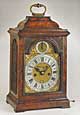 SIMON DE CHARMES LONDON. Walnut spring-driven table clock, c. 1730. Height: 39 cm. 