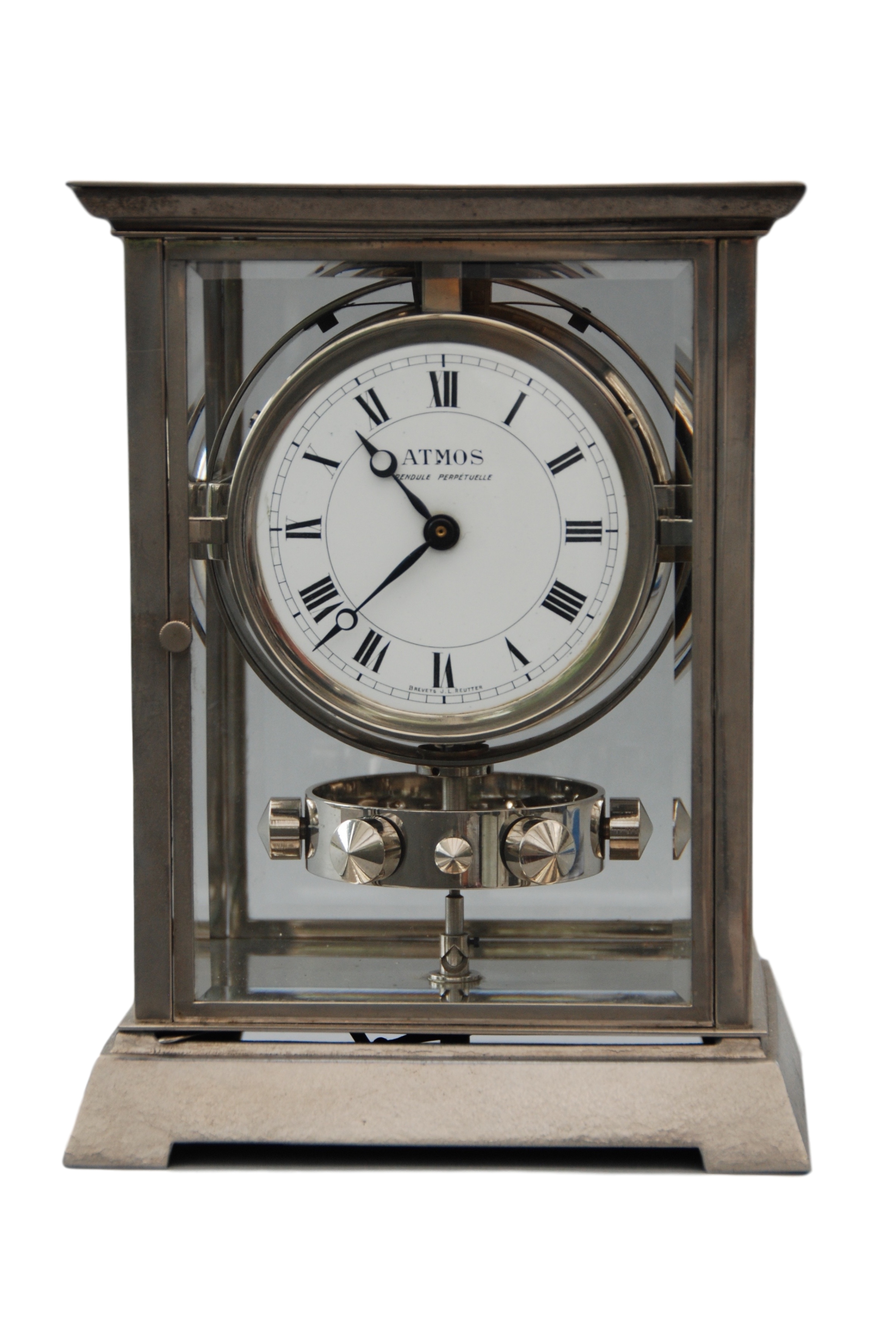 An early 1930 nickel plated art deco style J.L. Reutter four-glass atmos clock, small version.