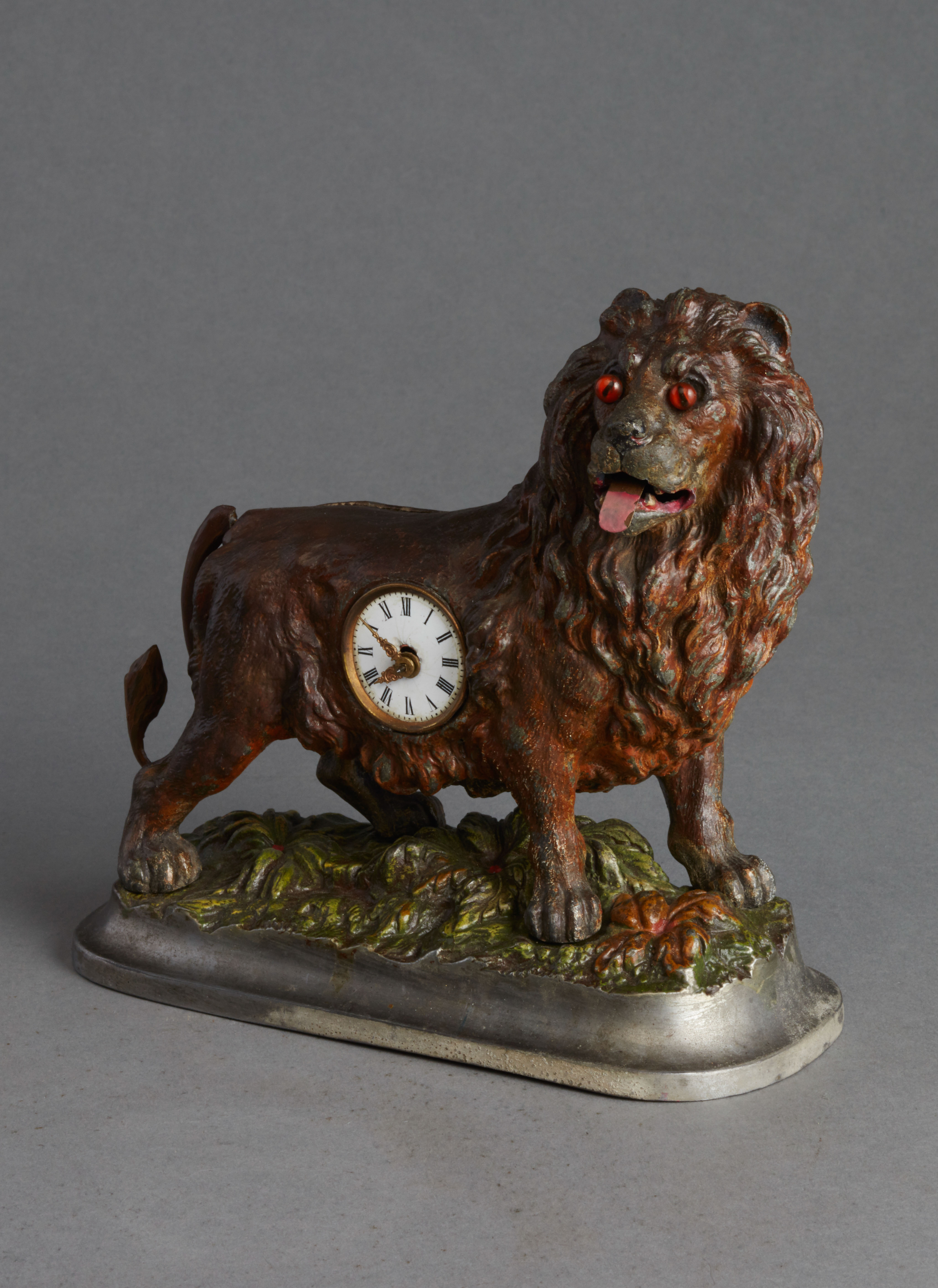 Small animated lion desk clock, circa 1880.