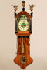 A small Dutch Frisian stained oak wall clock, named 'kantoortje', second quarter 19th Century
